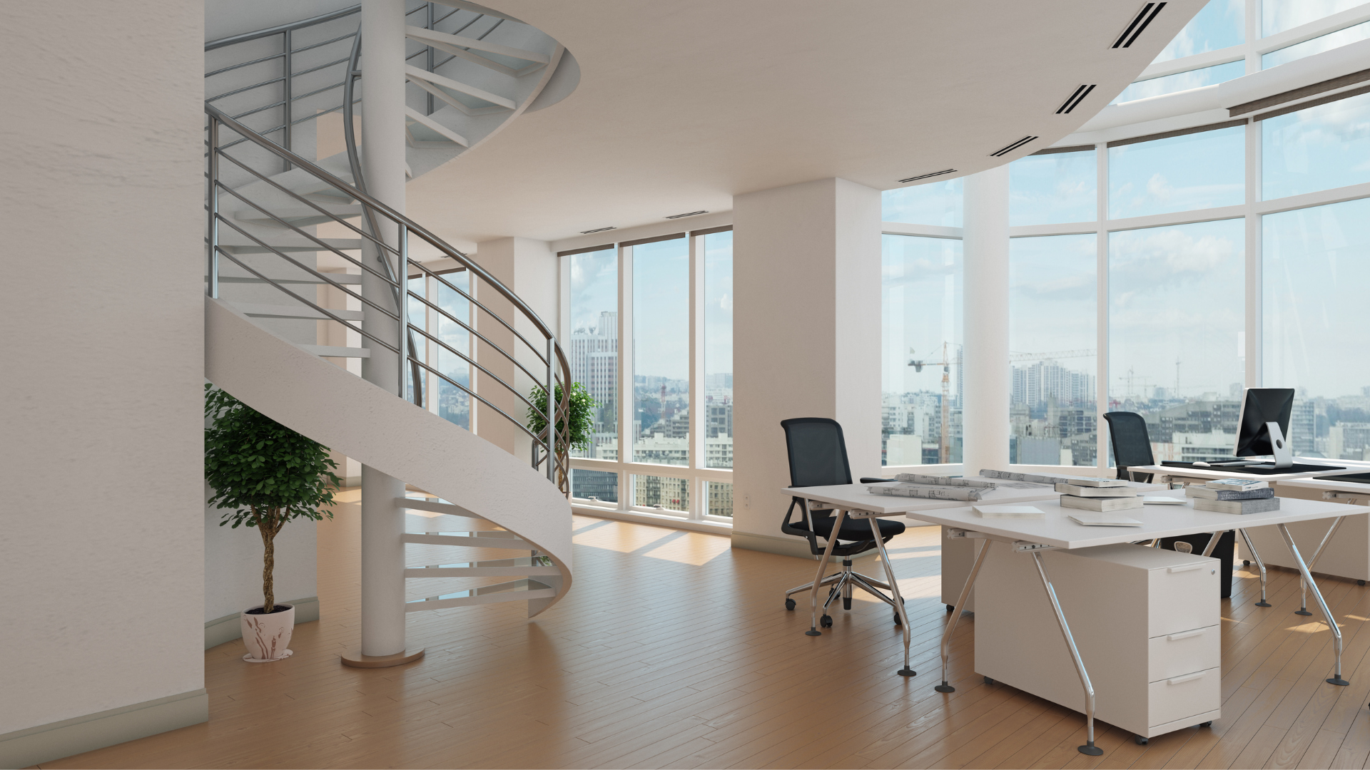 Ein helles und moderenes Bürogebäude mit Arbeitstischen und einer Wendeltreppe, die nach oben führt.